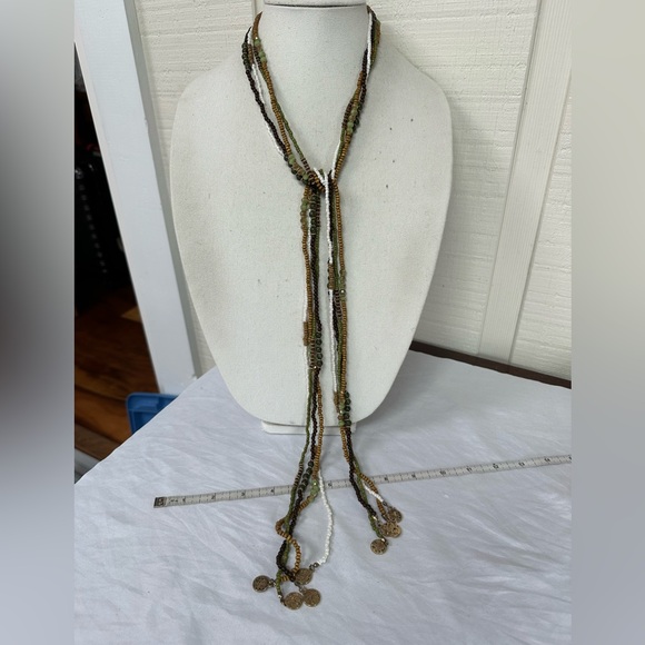 Long multi strand necklace with neutral tone beads and gold dangles - Picture 3 of 6